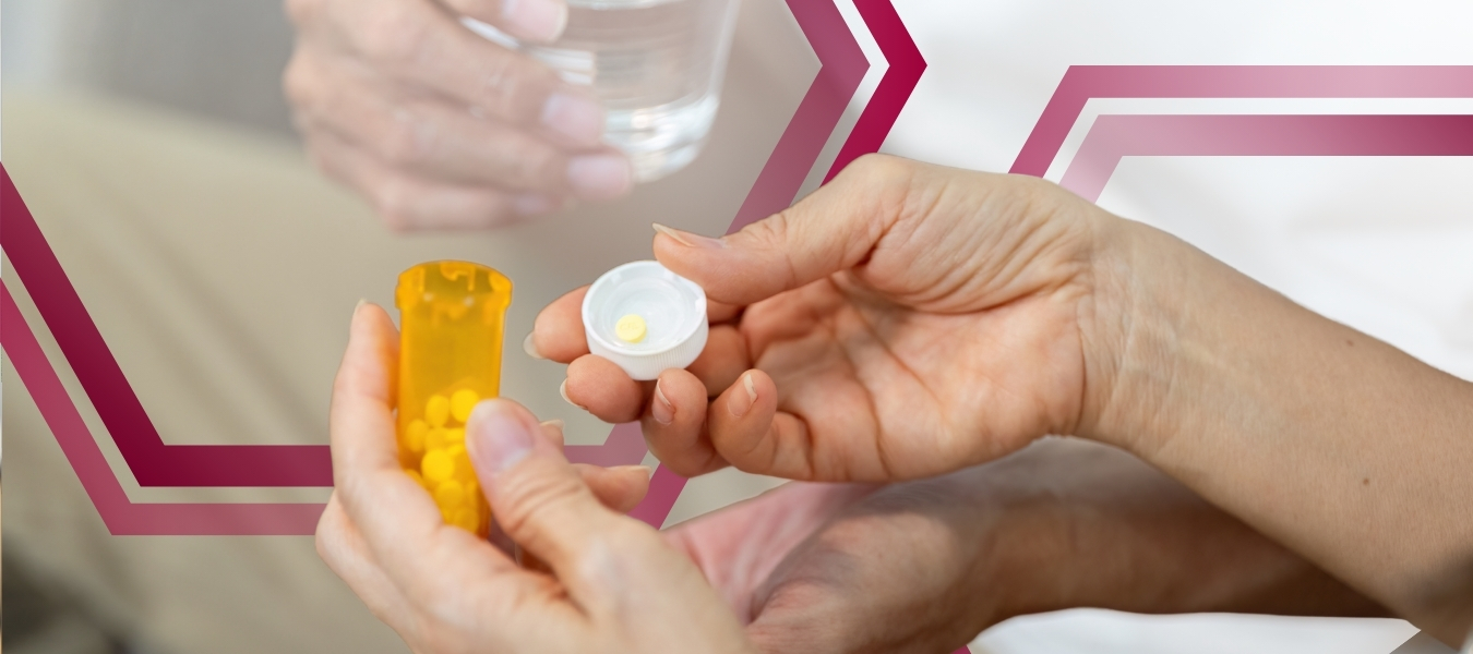 person-holding-chronic-medication-pills-and-water